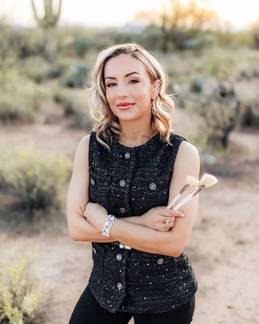 Heather Witherell holding professional esthetician tools in Tucson