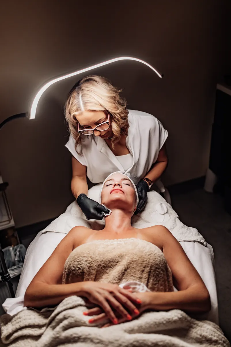 Heather preparing a client's skin at the start of a Tucson microneedling visit