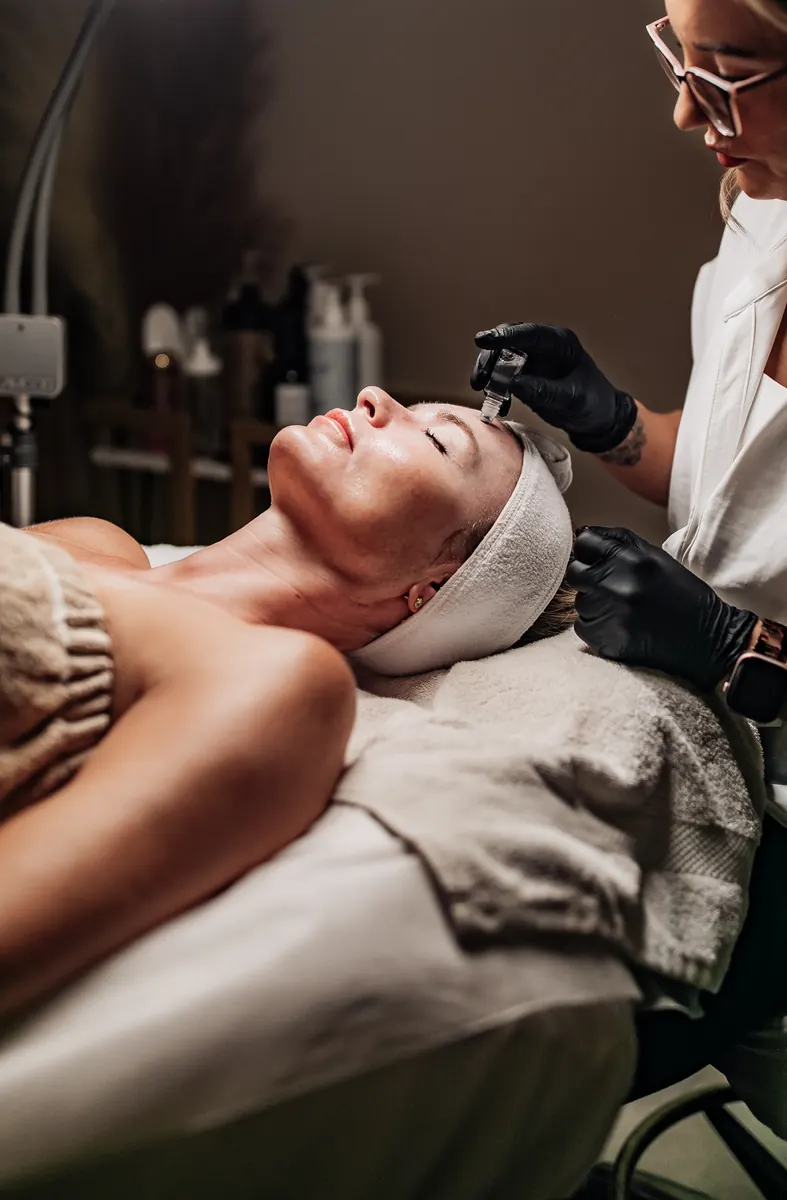 Close view of a professional microneedling device used during treatment in Tucson